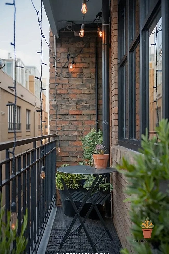 20 Small Balcony Looks We're Obsessed With This Year 13 Industrial Metal and Concrete Look