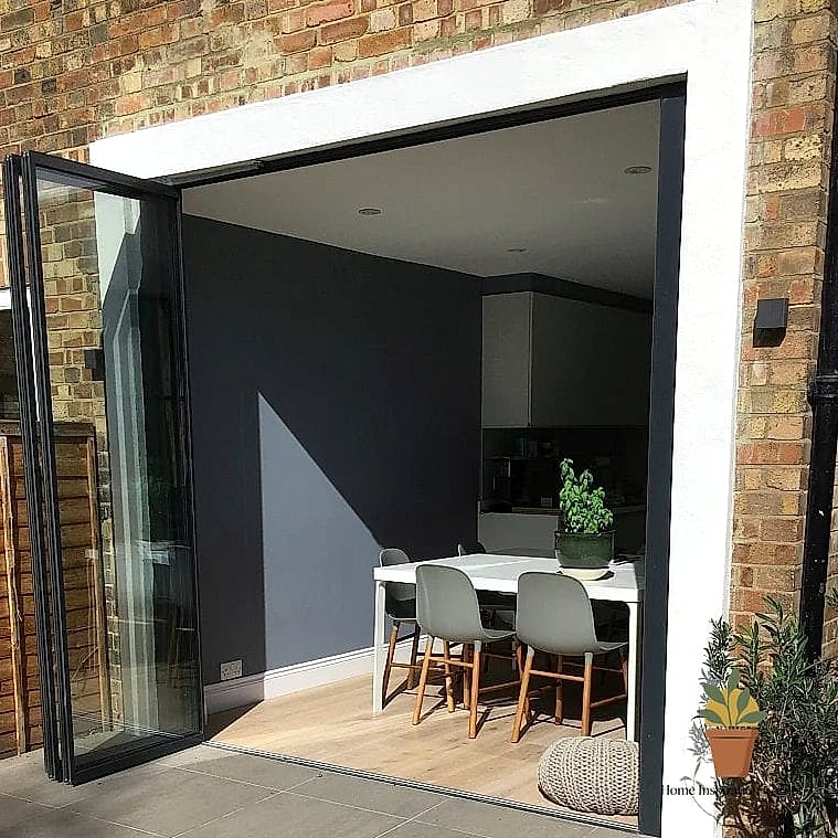 Bifold Doors Leading to a Small Courtyard Patio