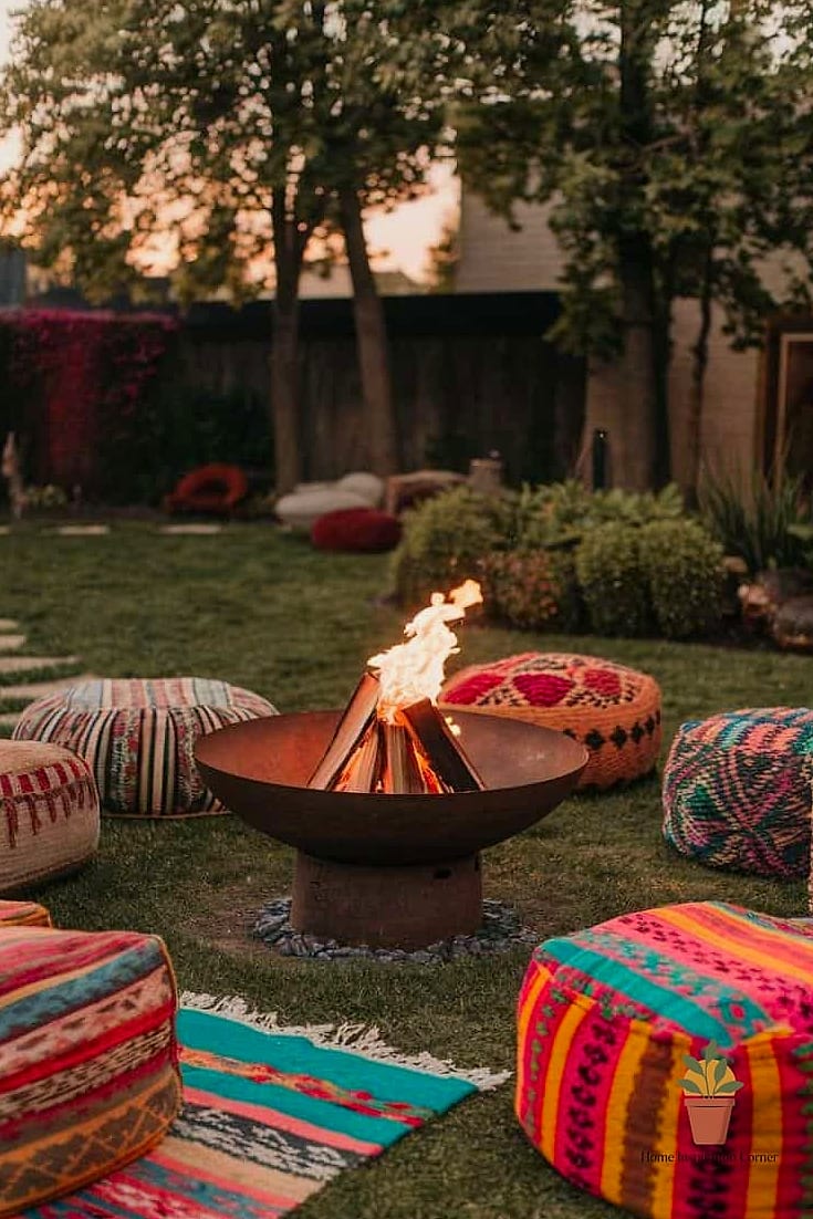 Boho Fire Pit Circle with Layered Rugs and Pillows