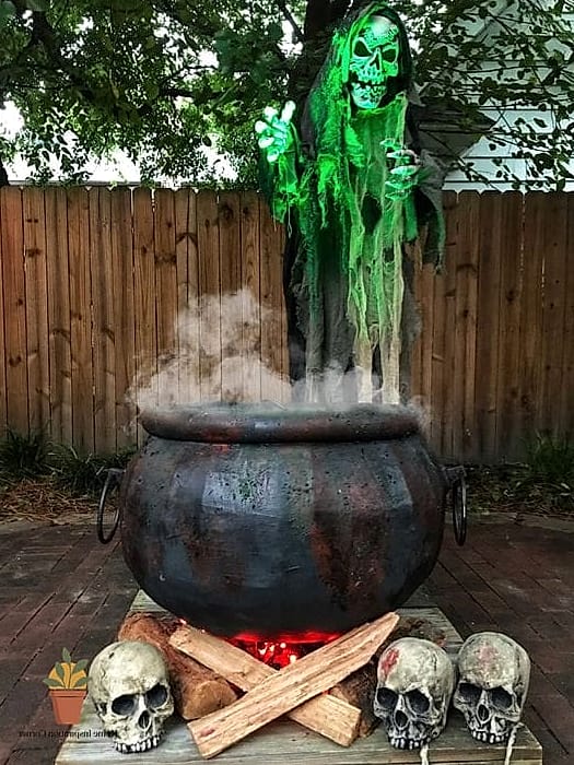 A Cauldron Filled With Glowing Orbs or Dry Ice