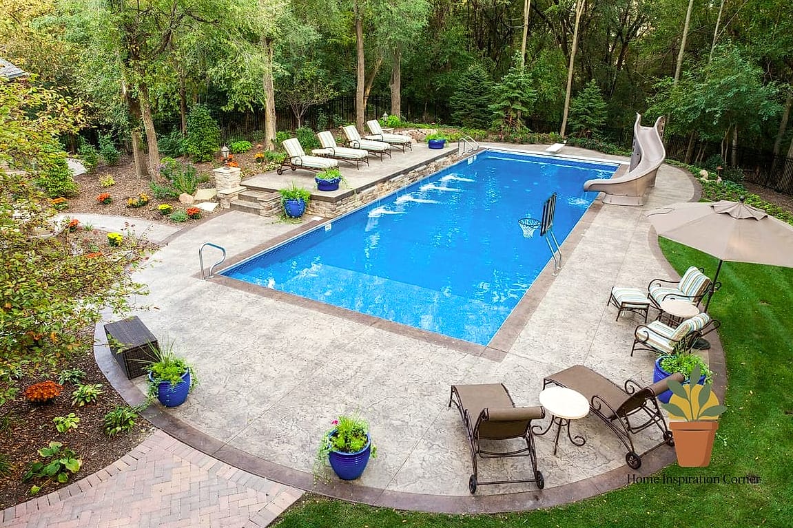 19 Backyard Patio Designs With Pool Makeovers That Look Incredibly Expensive 19 Concrete Pool Deck with a Wood-Look Stamped Pattern