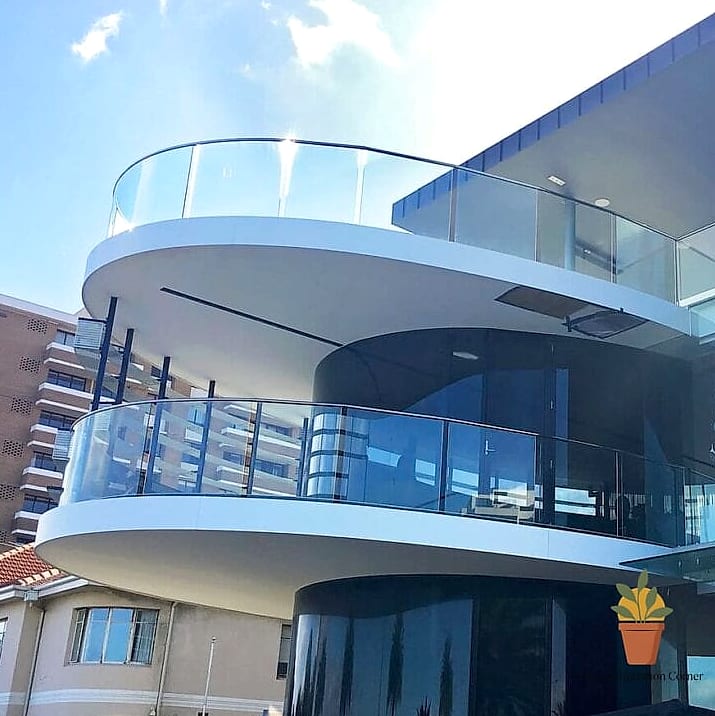 Curved Glass Balcony for a Rounded Facade