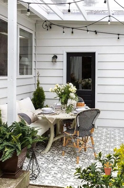 18 Outdoor Terrace Design Photos That Will Inspire Your Next Project 16 Farmhouse Terrace with Wood Beams and String Lights