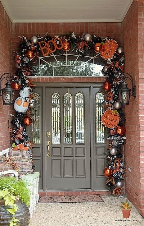 A Front Door Painted or Wrapped in Halloween Colors