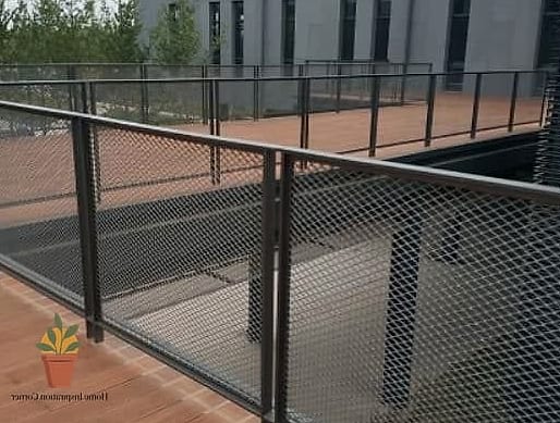 Iron Railing with Woven Wire Mesh Backing