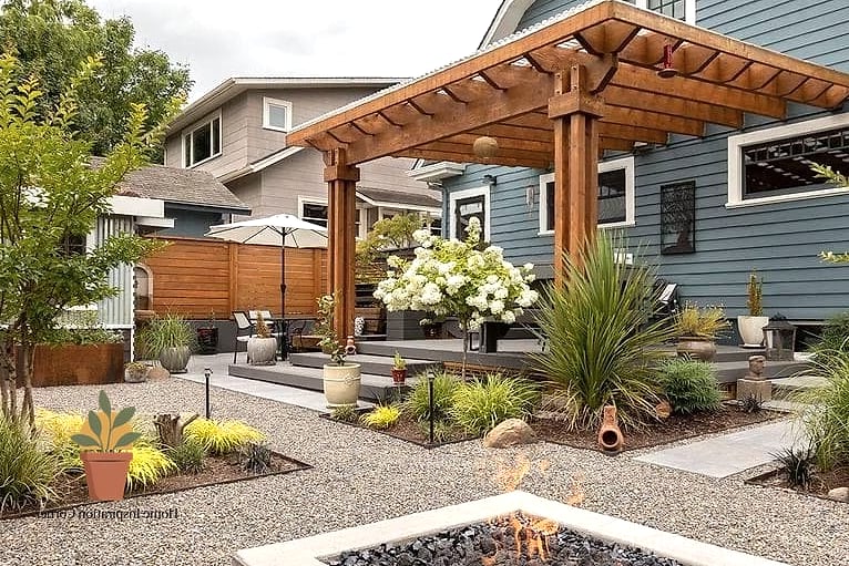 Pea Gravel Patio Framed by Raised Garden Beds