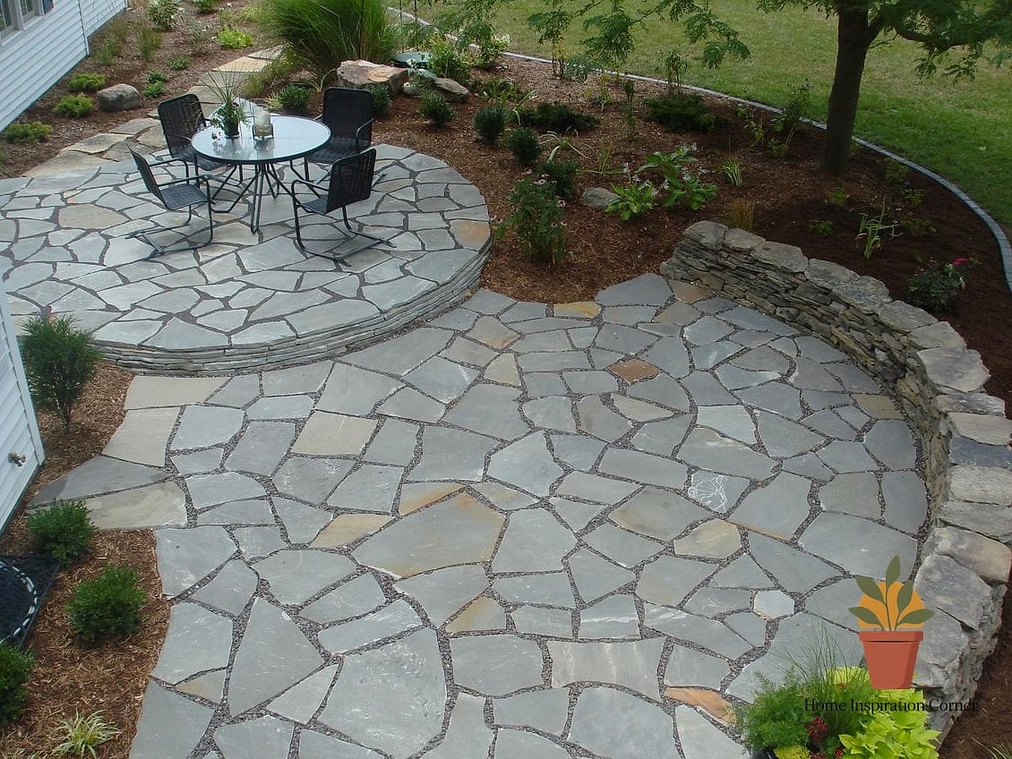 Raised Flagstone Patio with a Stacked Stone Retaining Wall