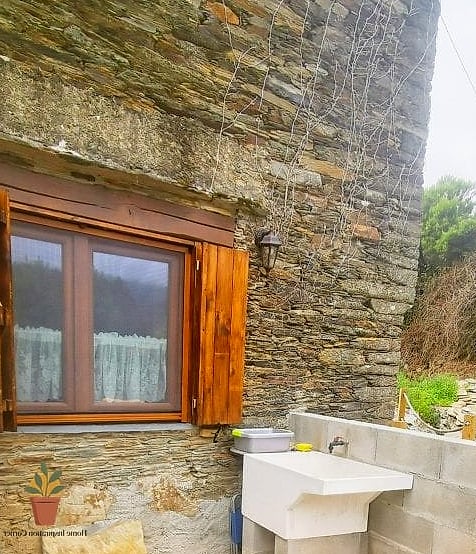 Rustic Stone Wall Laundry Area
