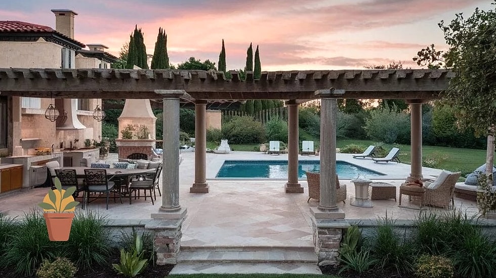 Tuscan-Inspired Patio with Arched Fireplace Opening
