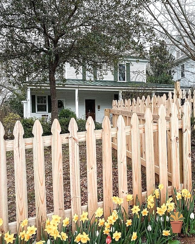 A Wood Fence with a Rustic Gate